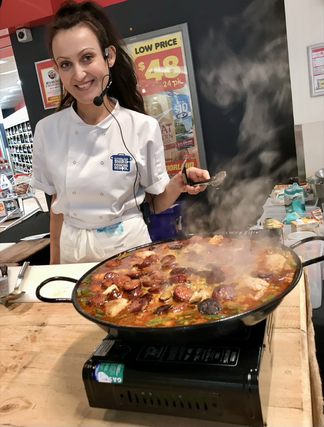 Yvonne cooking at a live cooking demonstration